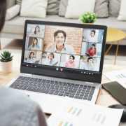 Over-the-shoulder angle of team on virtual meeting