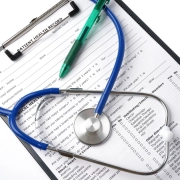 medical records sheet on a clip board with a stethoscope on top